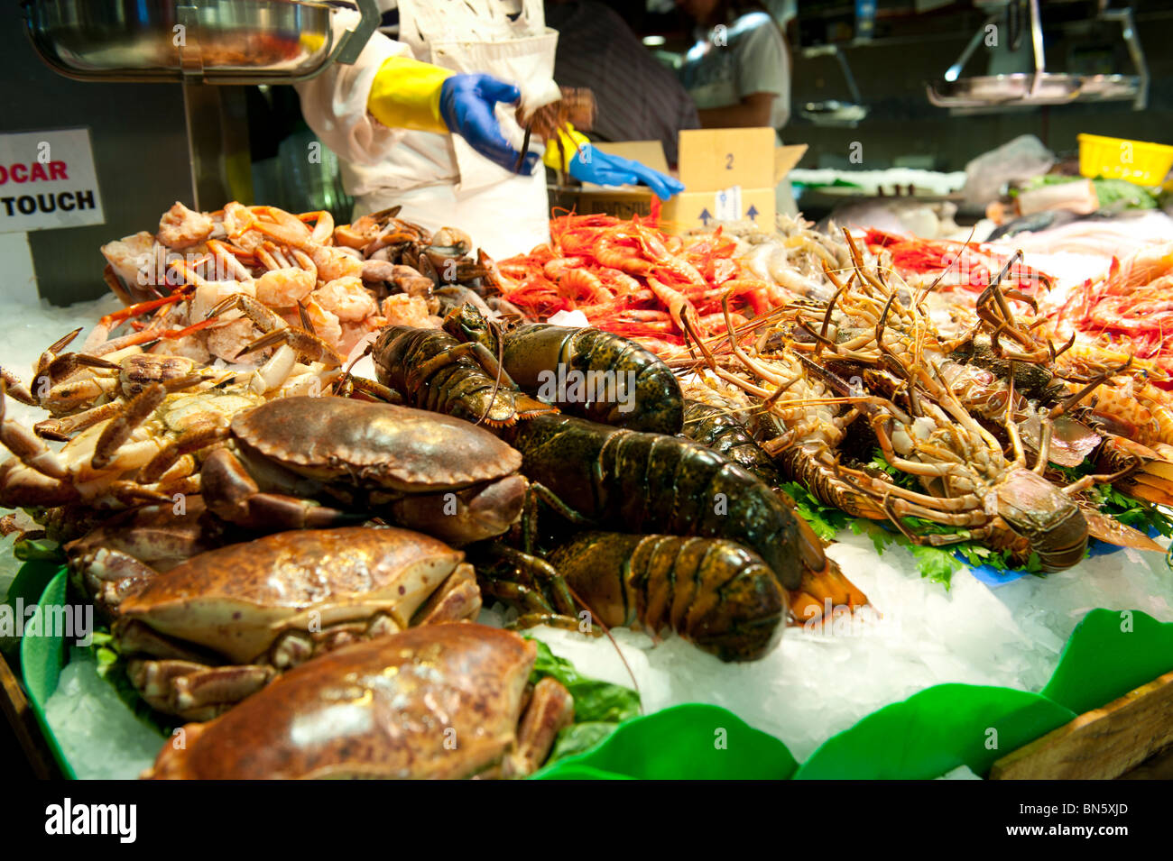 Fresh Fish and seafood shop at the market of La Boqueria in las Ramblas