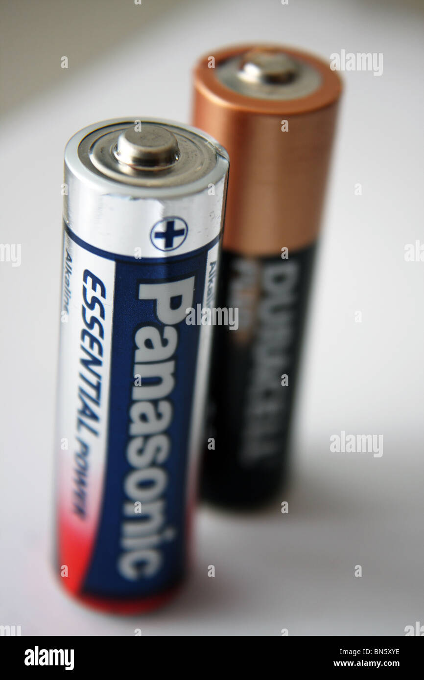 A Duracell Plus AA battery and a Panasonic AA battery product image. Stock Photo