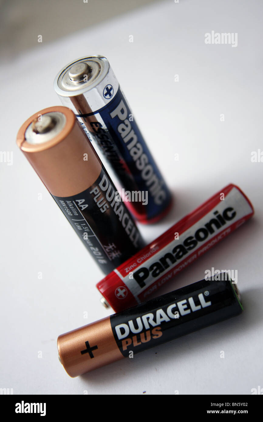 A selection of AA and AAA batteries in the brands of Panasonic Essentials and Duracell Plus. Stock Photo
