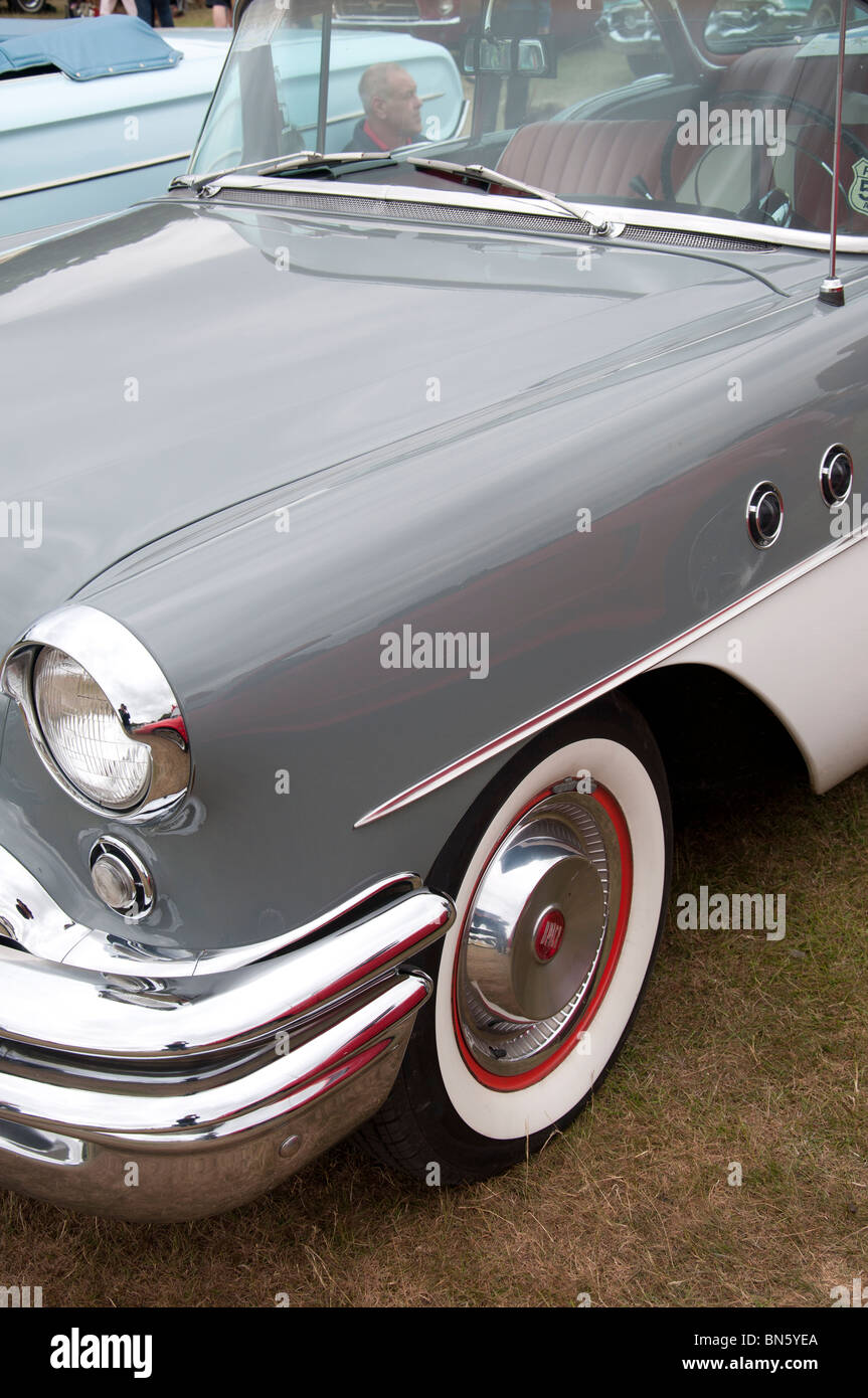 The front side of a 1955 Buick car at an American car show on 4th July