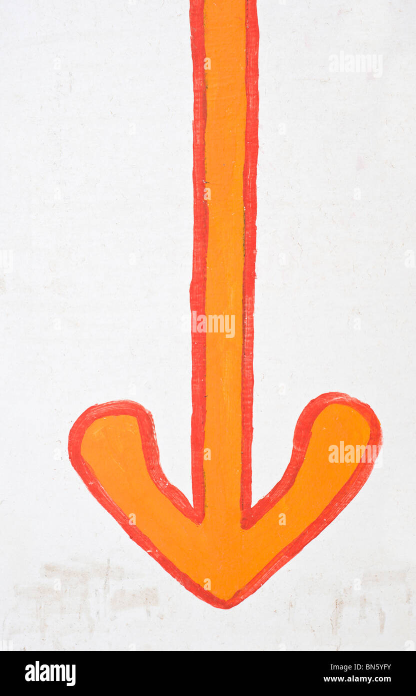 A red arrow points the way ... but in what direction? Tularosa, New Mexico. Stock Photo