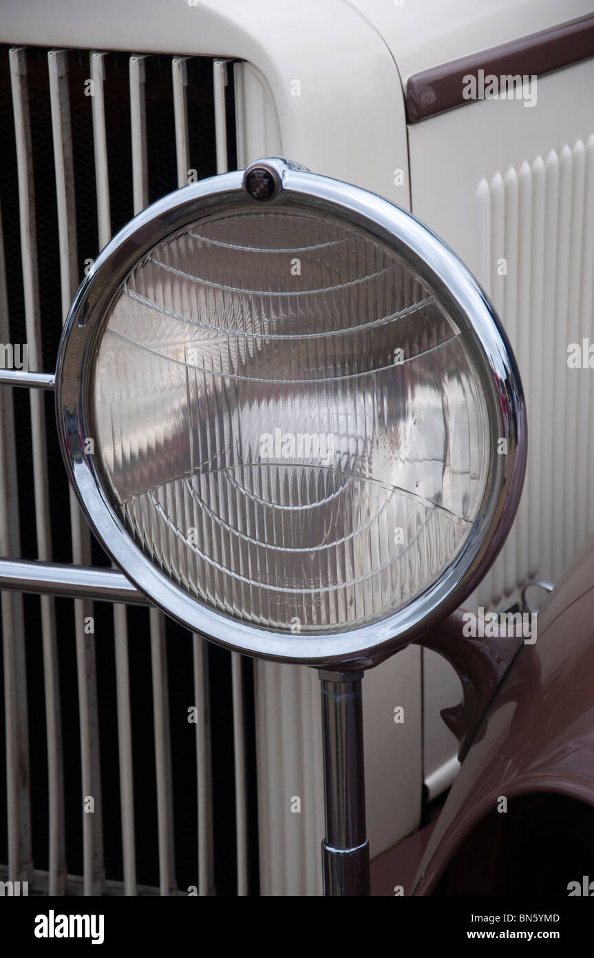 The front headlight of a 1930's Cadillac car at an American car show on 4th July 'Independence day' in Tatton Park, Cheshire. Stock Photo