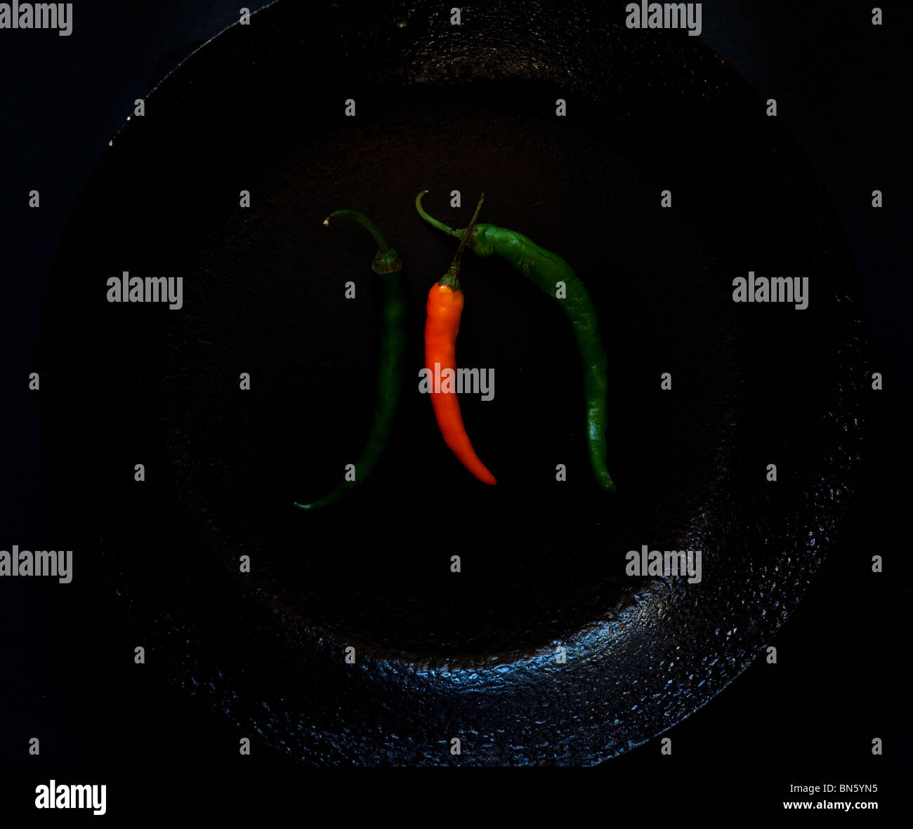 Chillies on black background Stock Photo