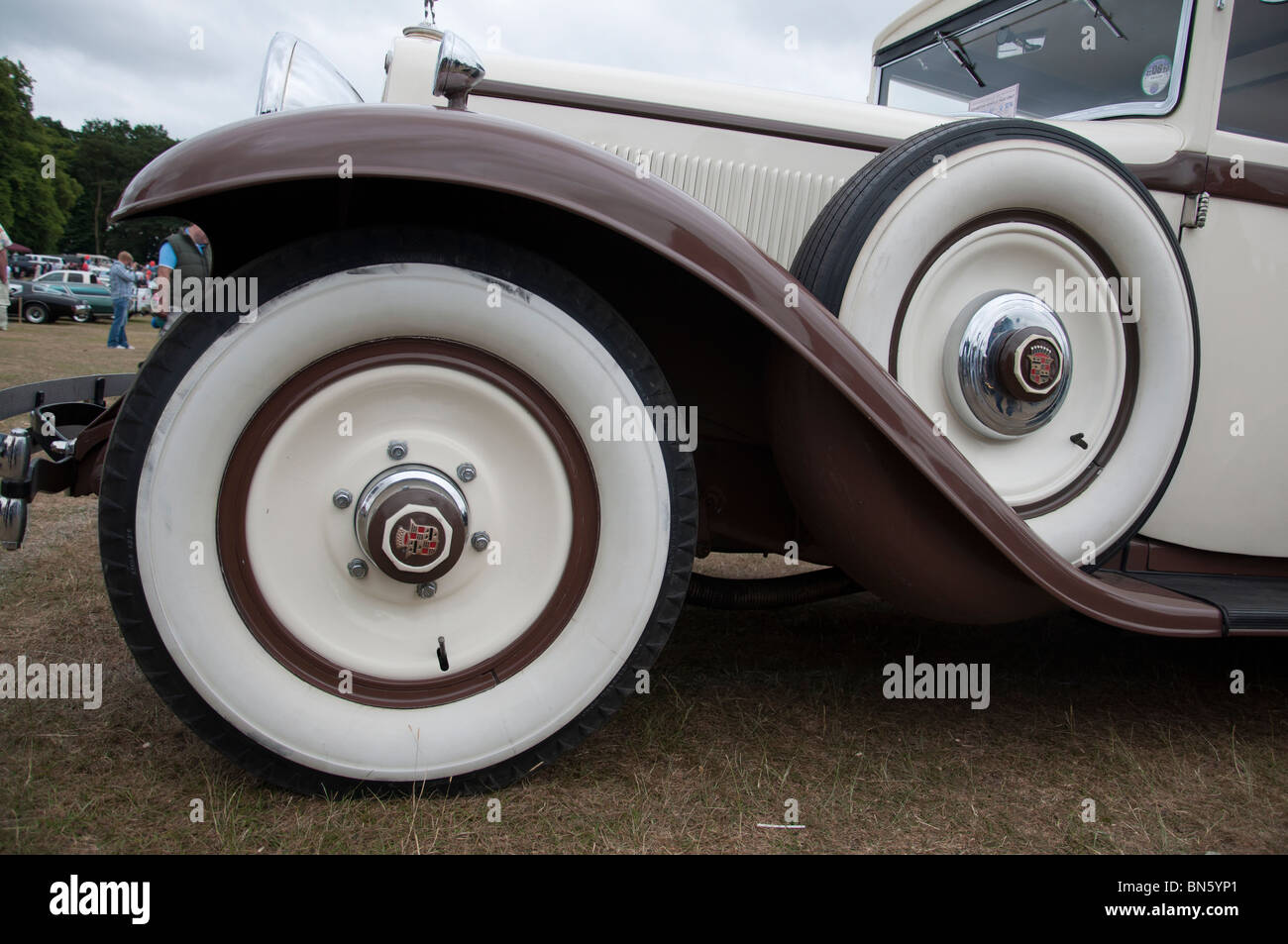 The wheel and arch of a 1930's Cadillac car at an American car show on 4th July 'Independence day' in Tatton Park, Cheshire. Stock Photo