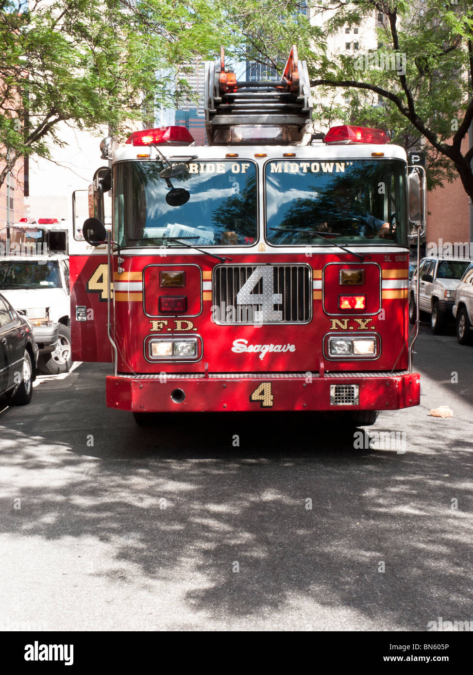 NY Fire Department FDNY Engine Company 4 fire truck parked on 51st street on sunny summer day in Manhattan New York City Stock Photo