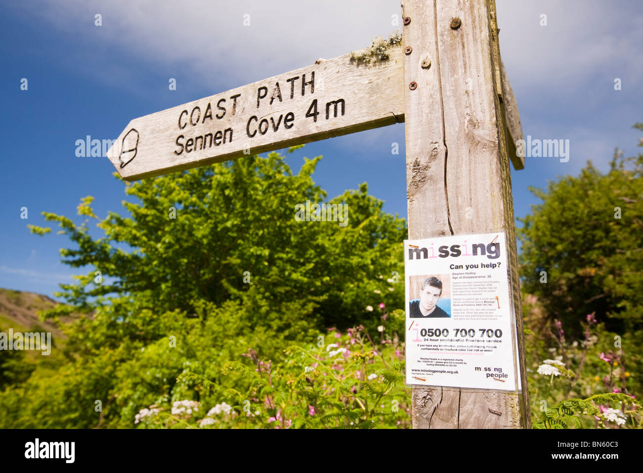 A poster about a missing person on a footpath sign post in St Just, Cornwall, UK. Stock Photo