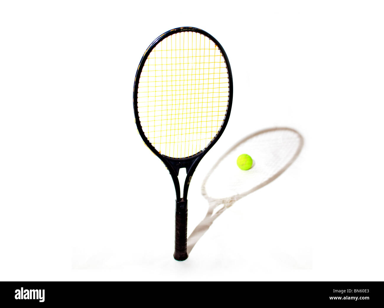 Tennis racket with shadow and ball Stock Photo