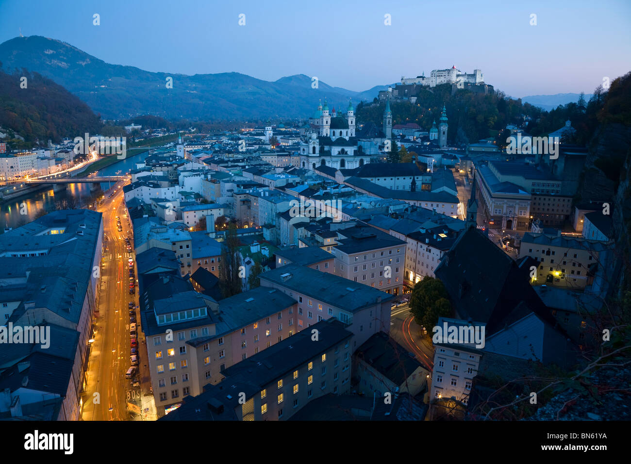 Alt Stadt & Hohensalzburg Fortress illuminated at dusk, Salzburg, Austria Stock Photo