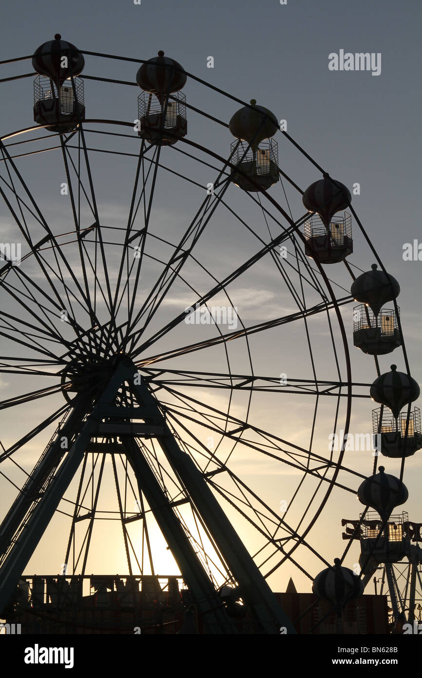 Silhouette of amusement park big wheel on the sea front in Skegness in ...