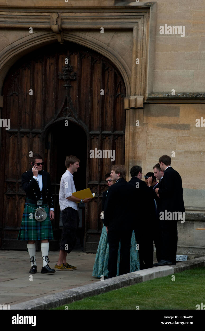 Students in evening dress gather outside the gates of Wadham College for the College's ball in June in Oxford. Stock Photo