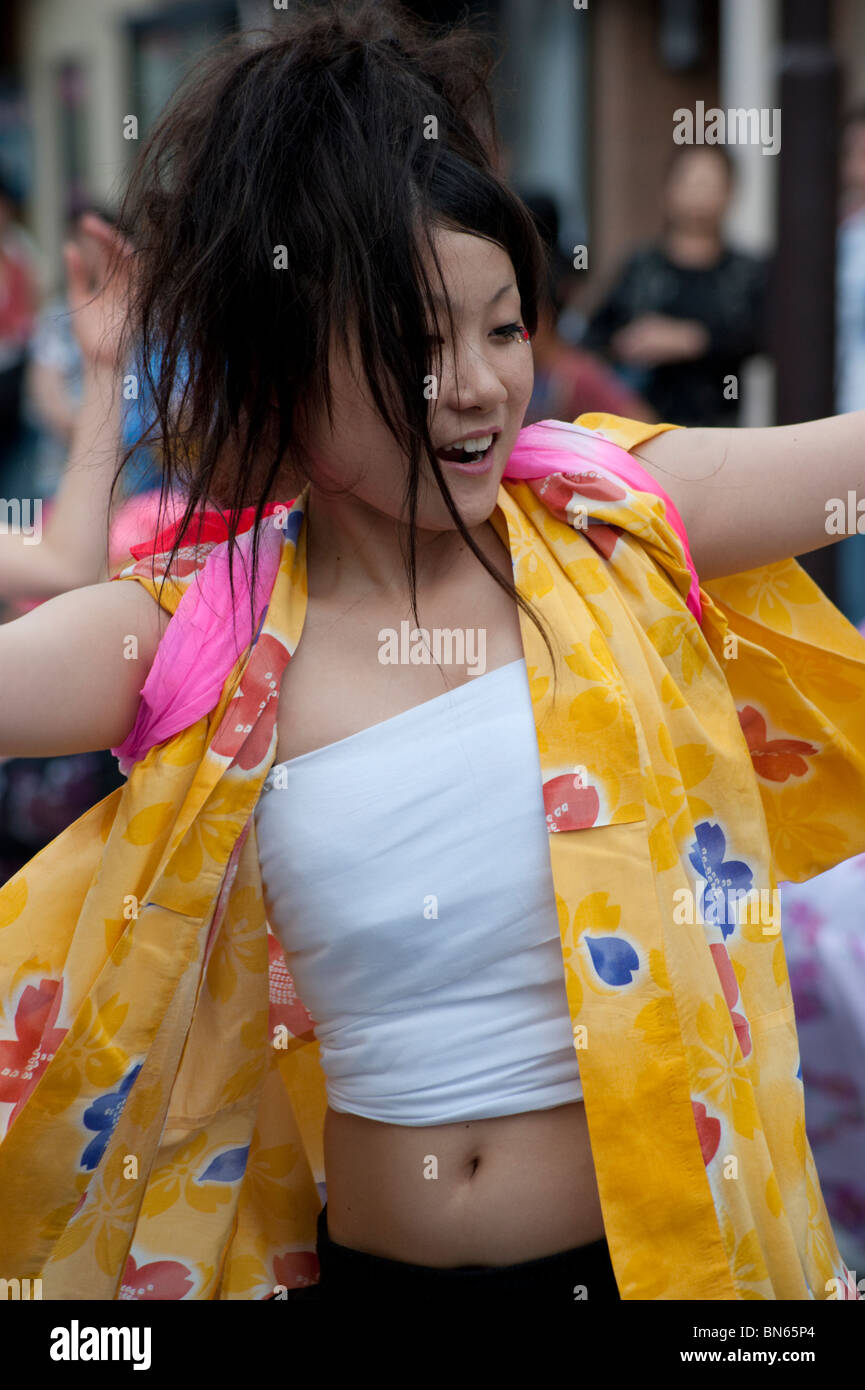 A young Japanese woman dances at a summer festival in Okaya, Japan. Stock Photo