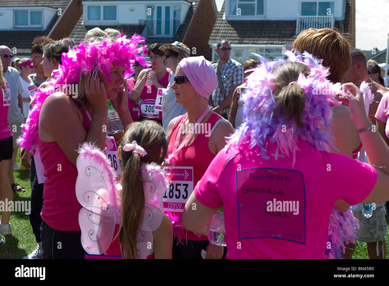 Women taking part in the race for life. A Cancer Charity event consisting of a 5k race for women only Stock Photo