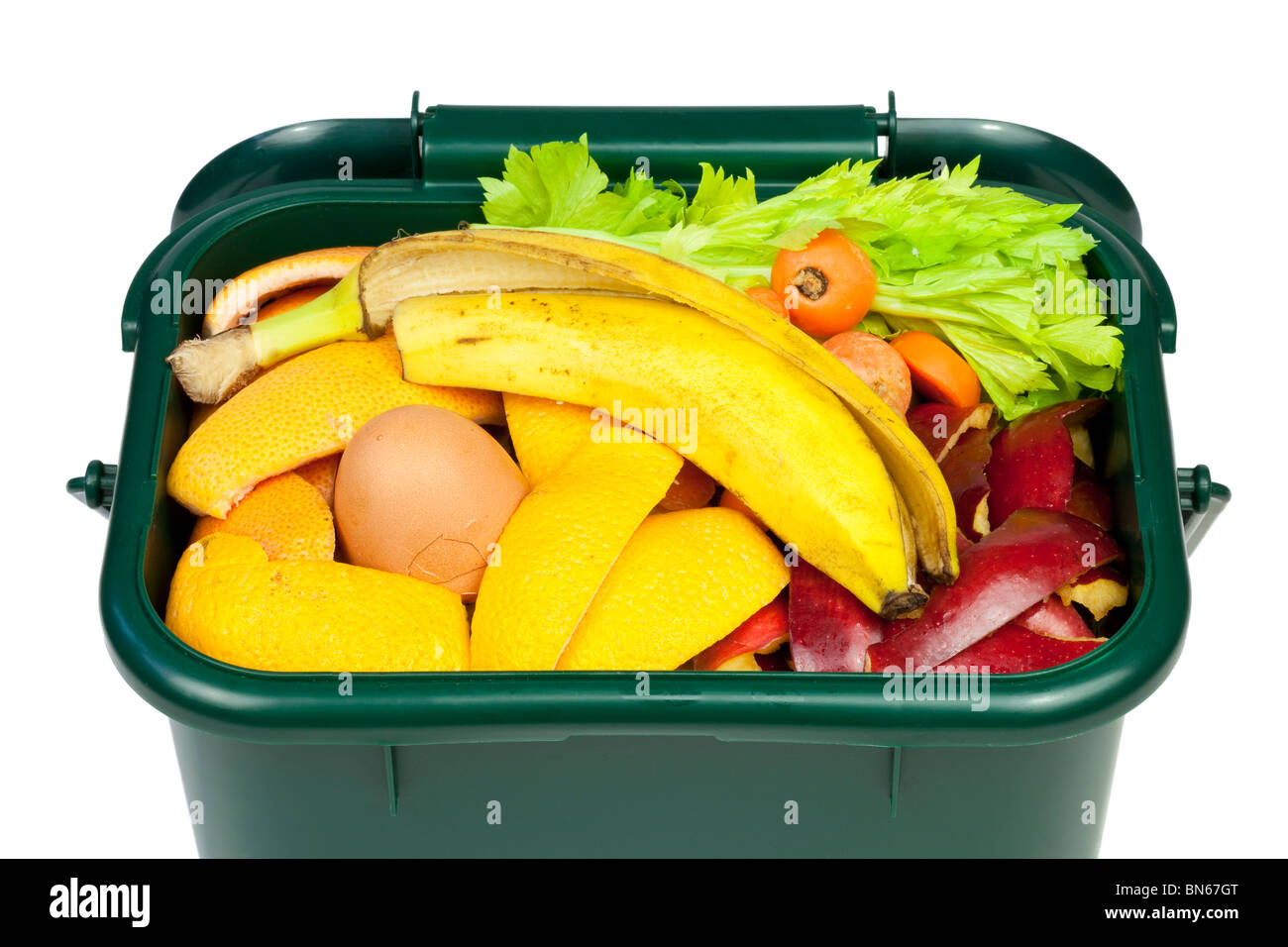 Food waste for composting in domestic recycling waste bin Stock Photo