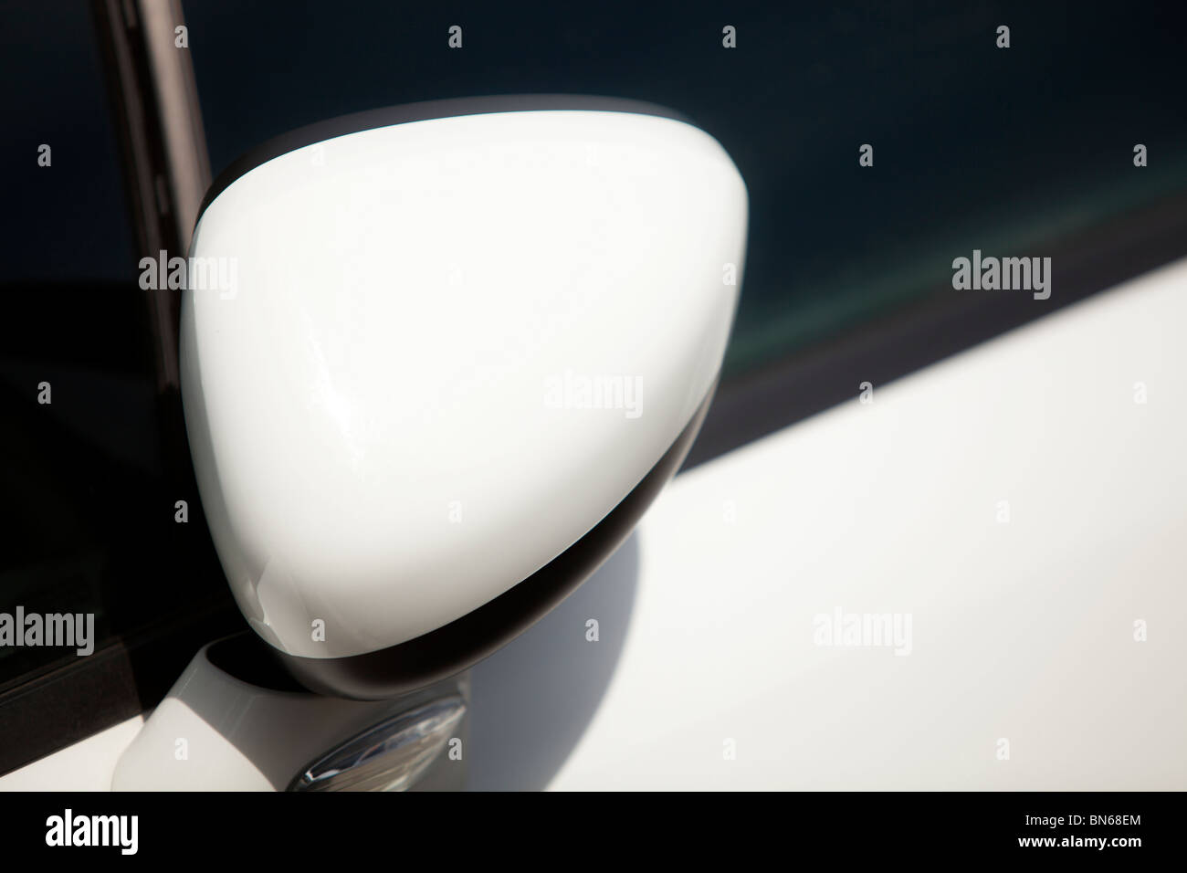Close up of a wing mirror on a white luxury car Stock Photo