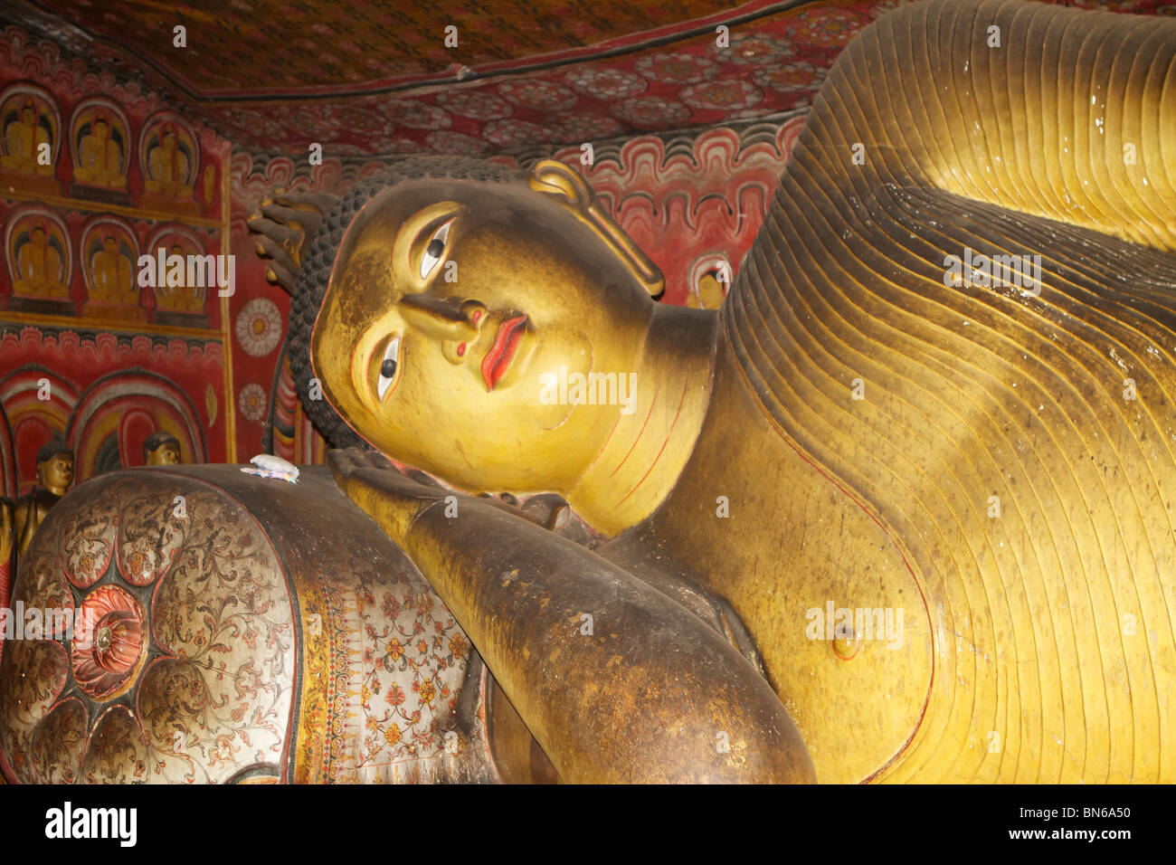 reclining Buddha in a dambulla cave Stock Photo