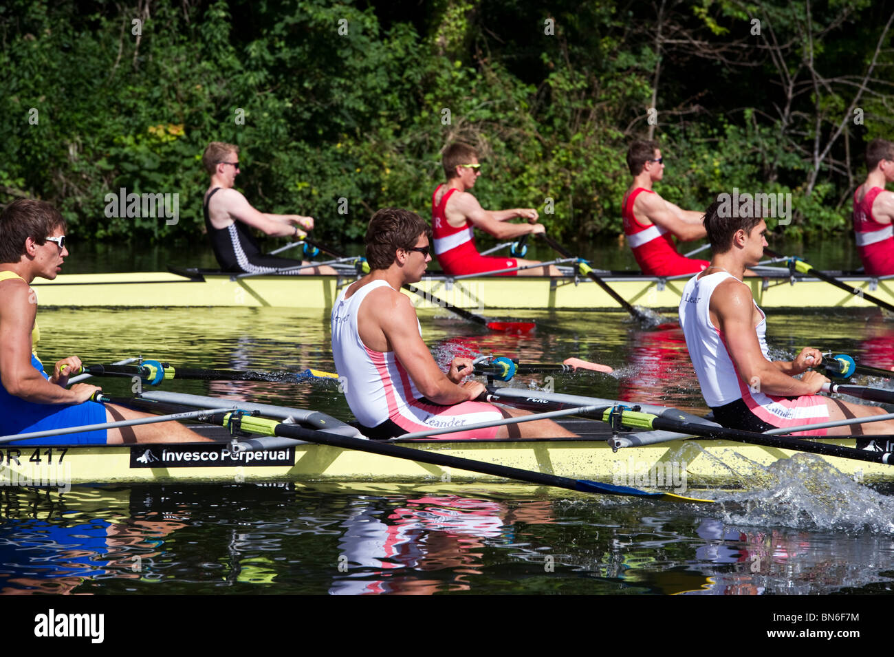 Competitive rowing teams and rowers rowing on the Thames at Henley