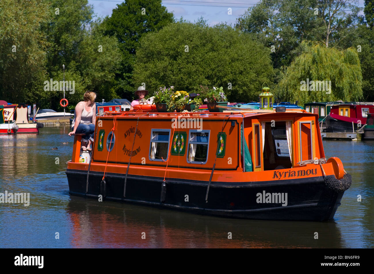 narrow canal boat Narrowboat Leaving Pyrford Marina Surrey England ...