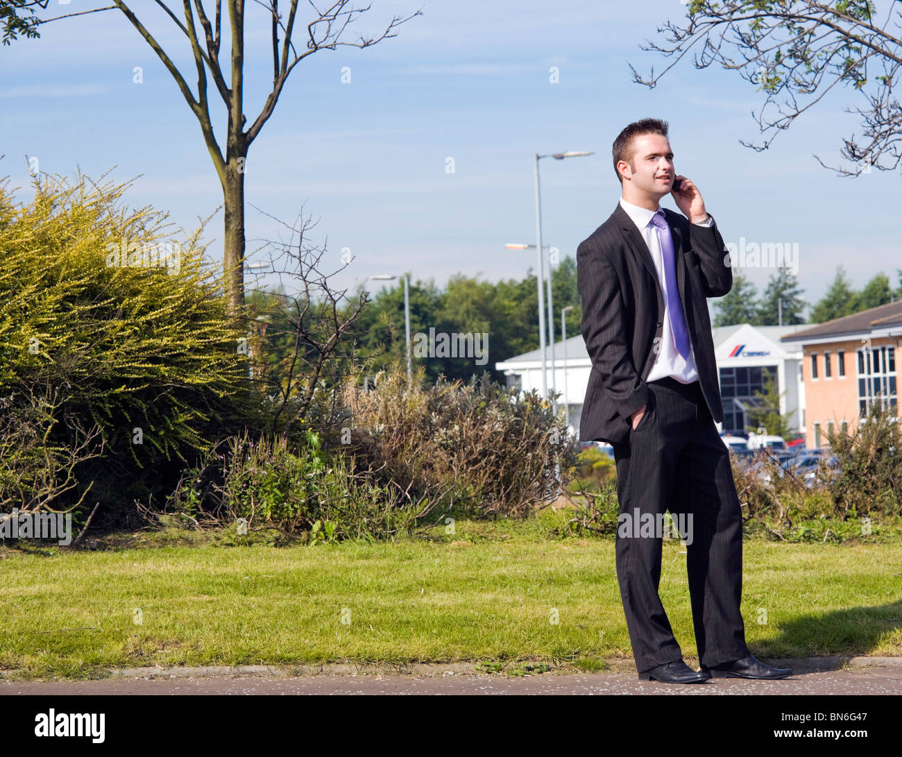 young scottish businessman talking outdoors on a mobile phone. unreleased. Stock Photo