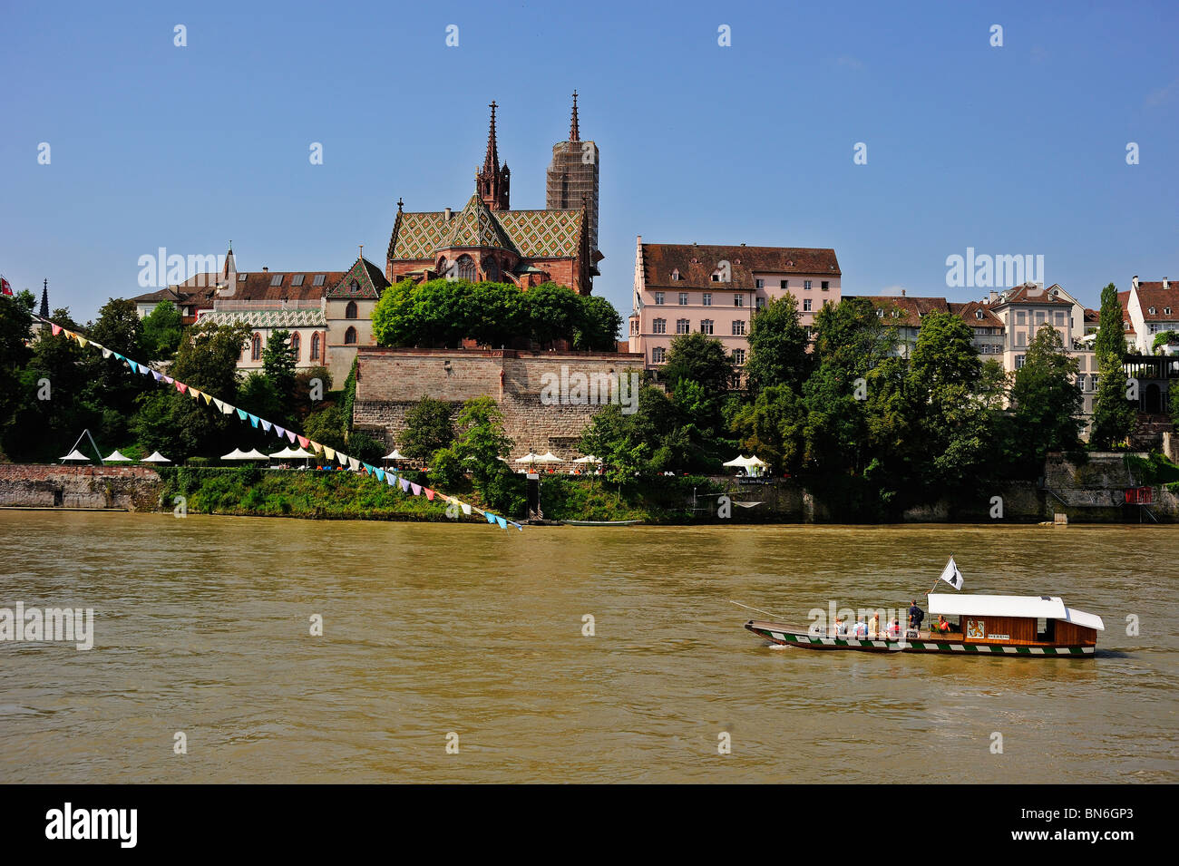 Cable ferry across the river Rhine in Basel (Basle, Bale, Basilea) Switzerland with Basel Munster (Cathedral) in the background Stock Photo