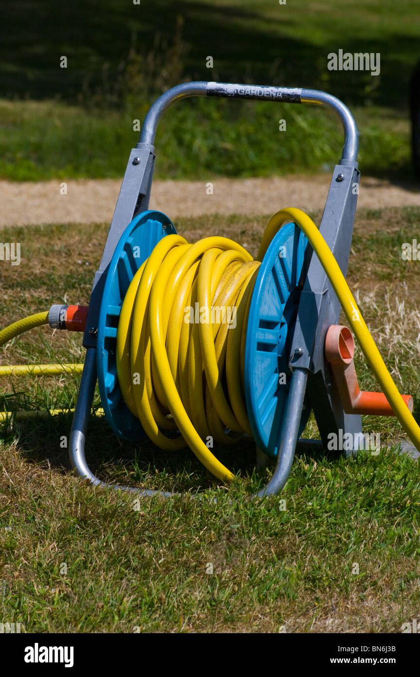 Yellow Garden Hose On A Reel Stock Photo Alamy