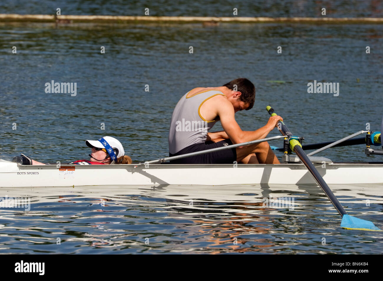Coxswain (cox for short) and rower relax just before the start of a race at Henley Royal Regatta. Stock Photo