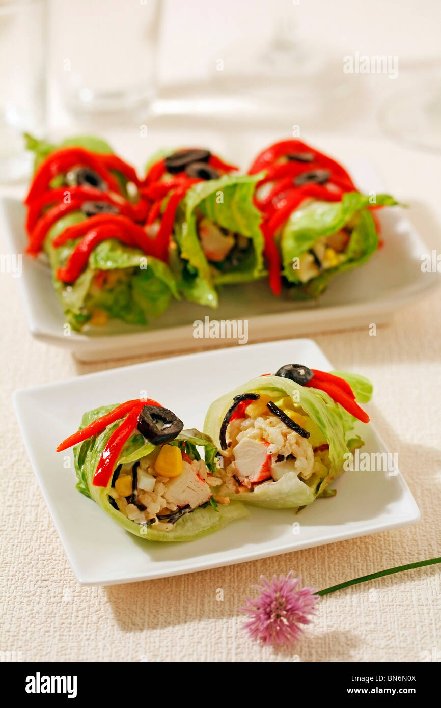 Lettuce rolls with rice, seaweed and surimi. Recipe available. Stock Photo