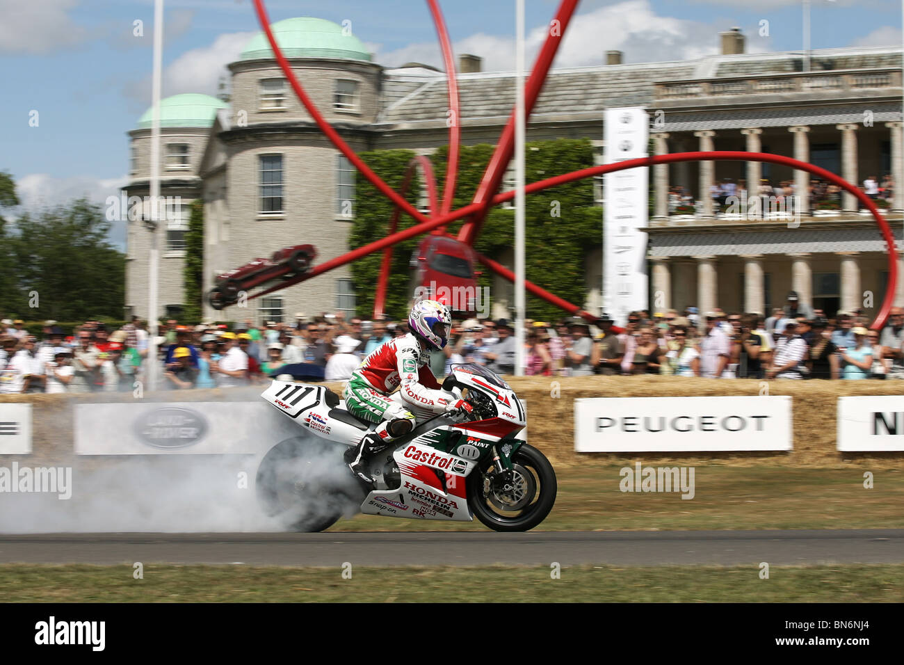 Honda World Superbike rider Aaron Slight lights up his tyres at the 2010 Goodwood Festival of Speed, Goodwood House. Stock Photo