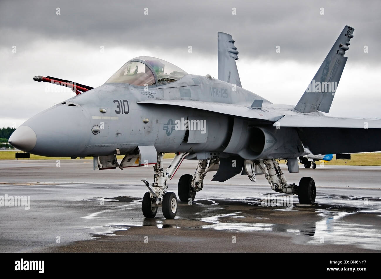 A sleek F16 Fighting Falcon is parked at the airport on display at the