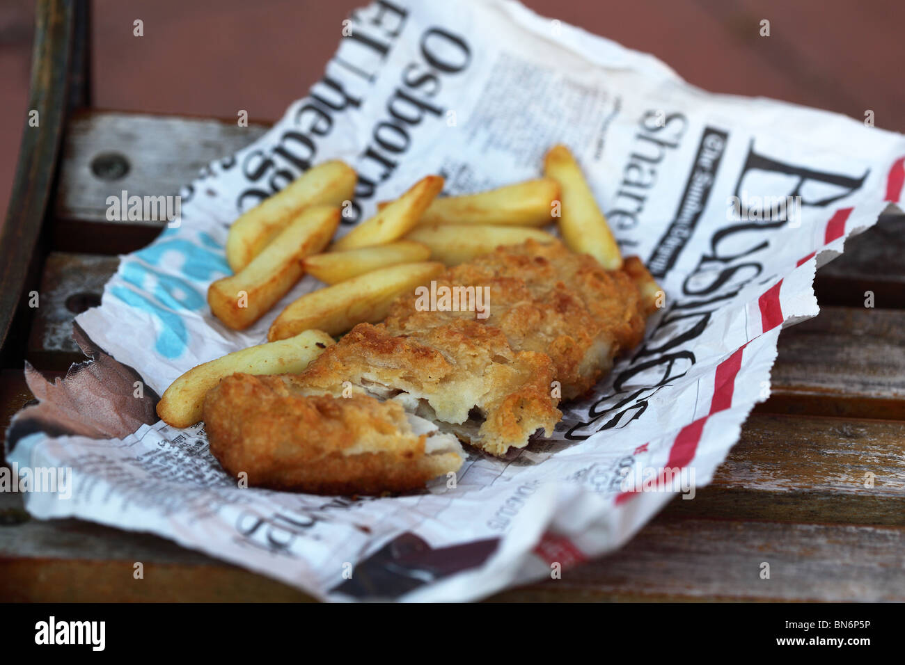 English fish chips served news paper Stock Photo - Alamy