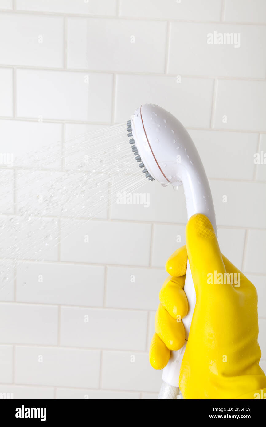 Cleaning Bathroom Tile Wall close up Stock Photo