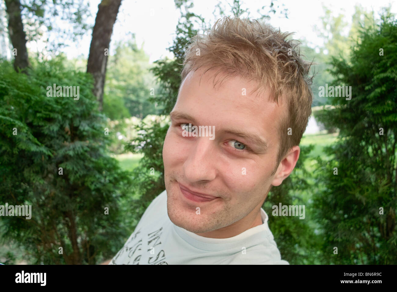 Young man looking at the camera Stock Photo - Alamy