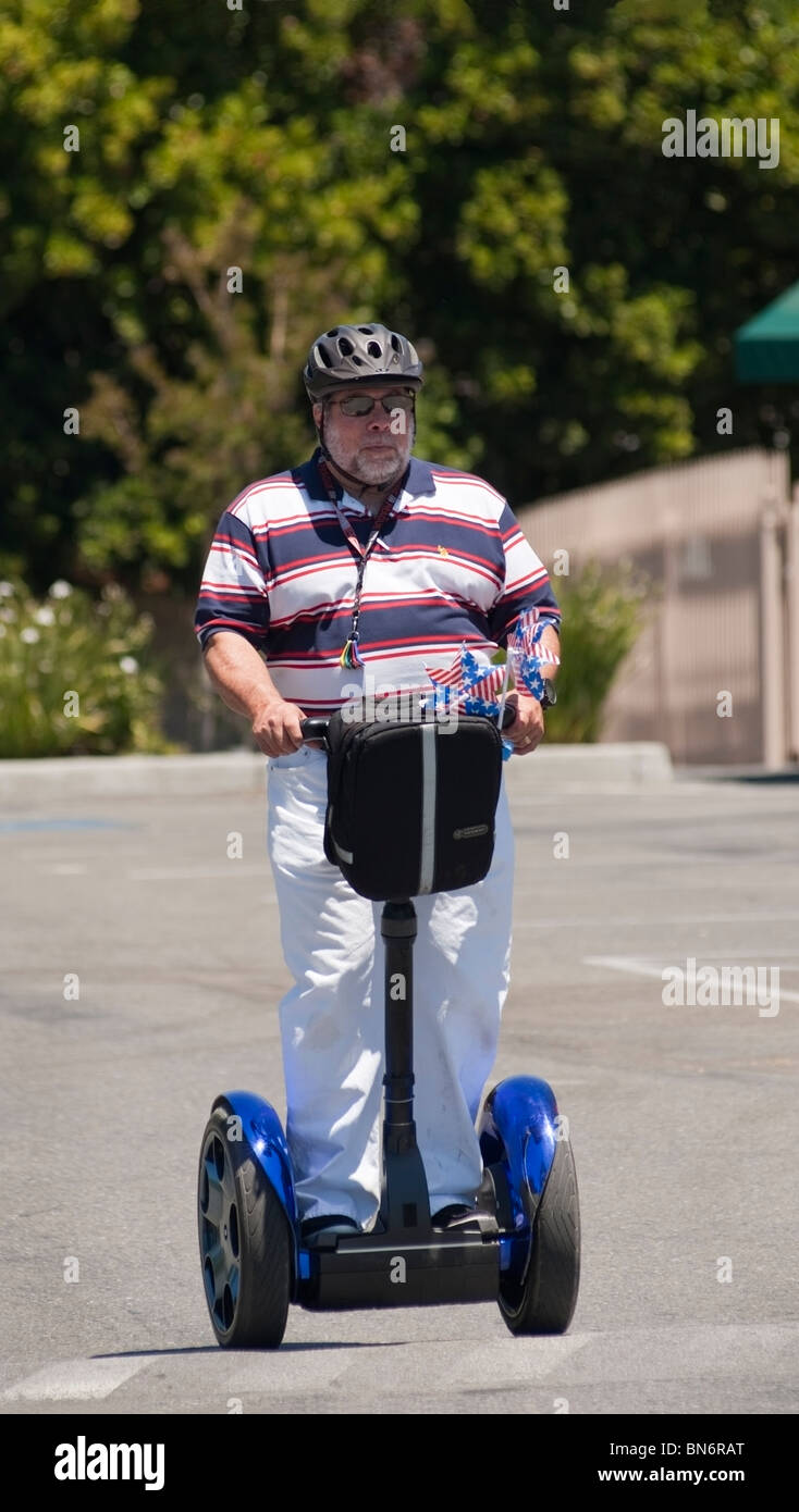 Steve Wozniak, Apple Inc. co-founder, rides a Segway after the 2010 Rose, White & Blue 4th of July Parade in San Jose, CA Stock Photo