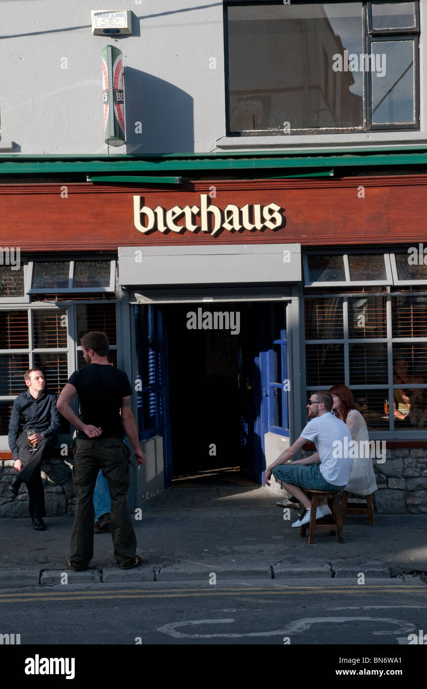 Exterior of the Bierhaus pub in Galway, Ireland with drinkers enjoying summer evening. Stock Photo