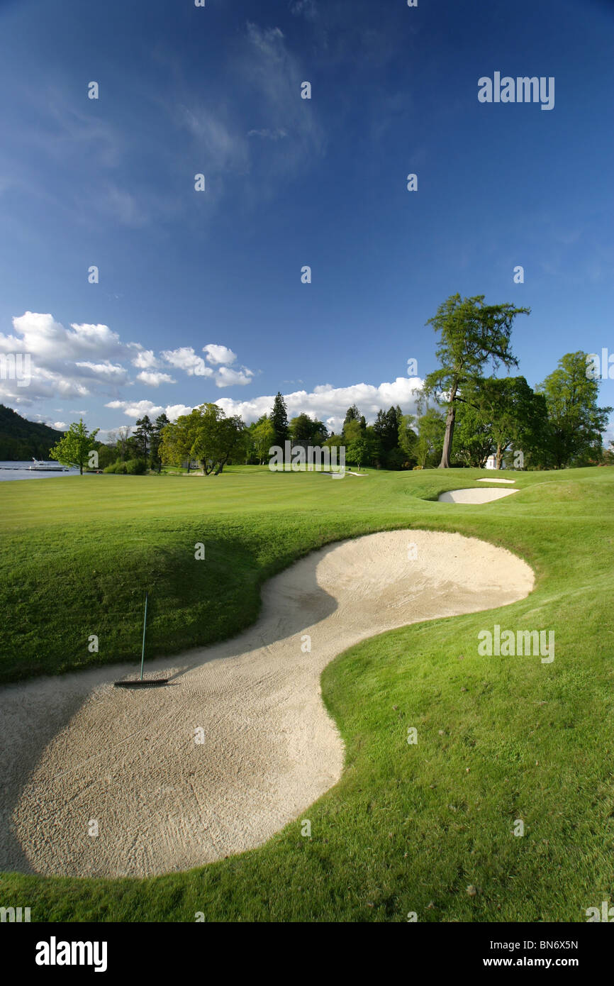 Loch Lomond Golf Course, Glasgow, Scotland. Hole 18 bunker and rough with trees in the background. Stock Photo