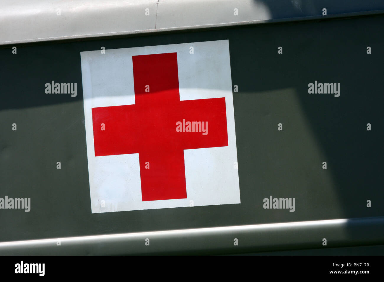 A Red Cross flag sign on an ambulance truck at a WWII reenactment camp Stock Photo