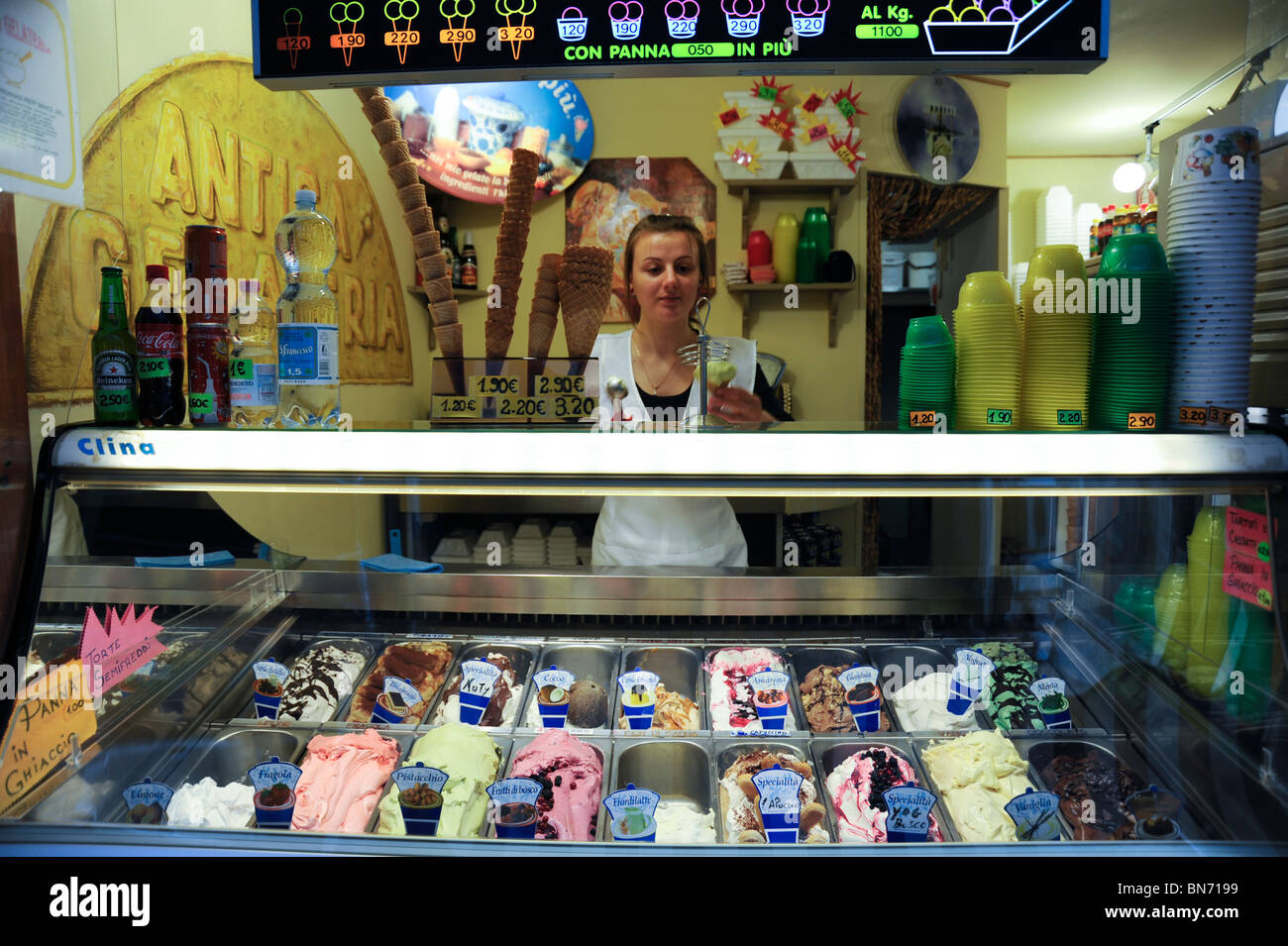 Ice cream shop in Venice Italy showing girl selling ice creams Stock