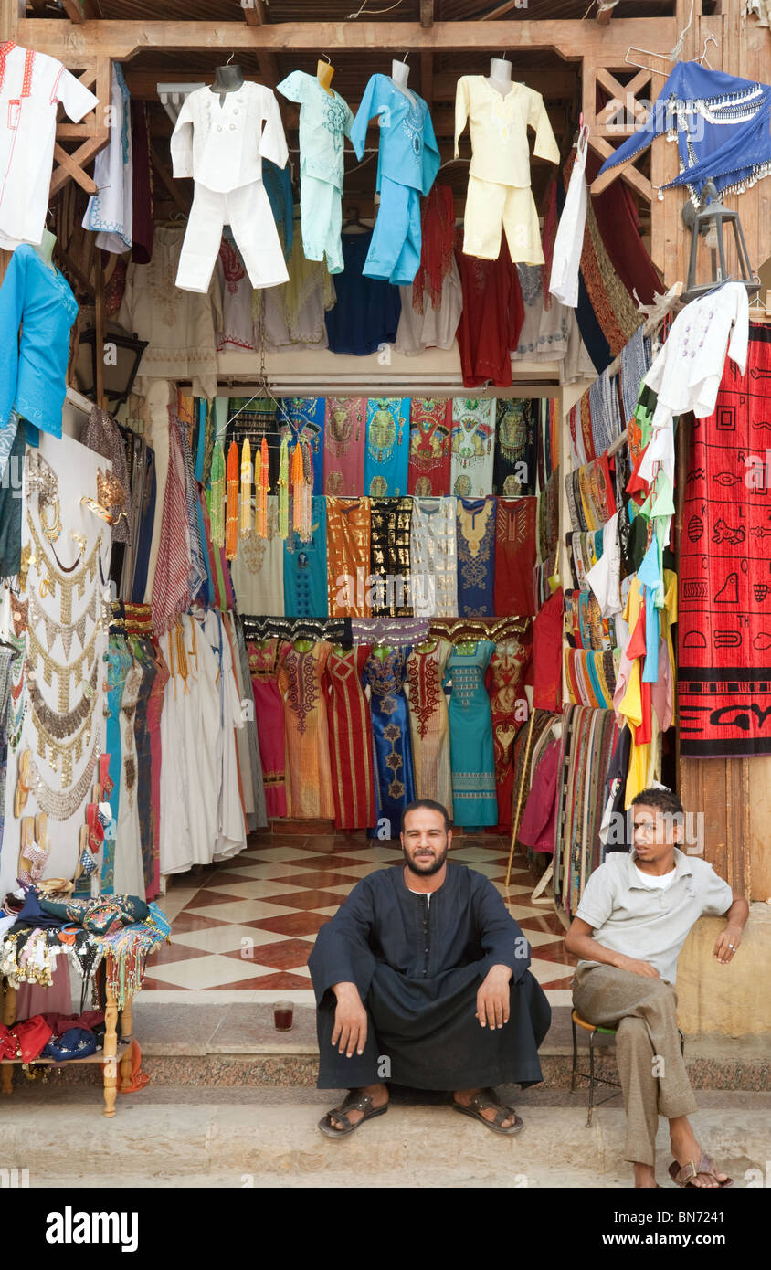 Egypt shop - Clothes shop and shopkeepers,  Aswan market, Aswan, Upper Egypt Africa Stock Photo