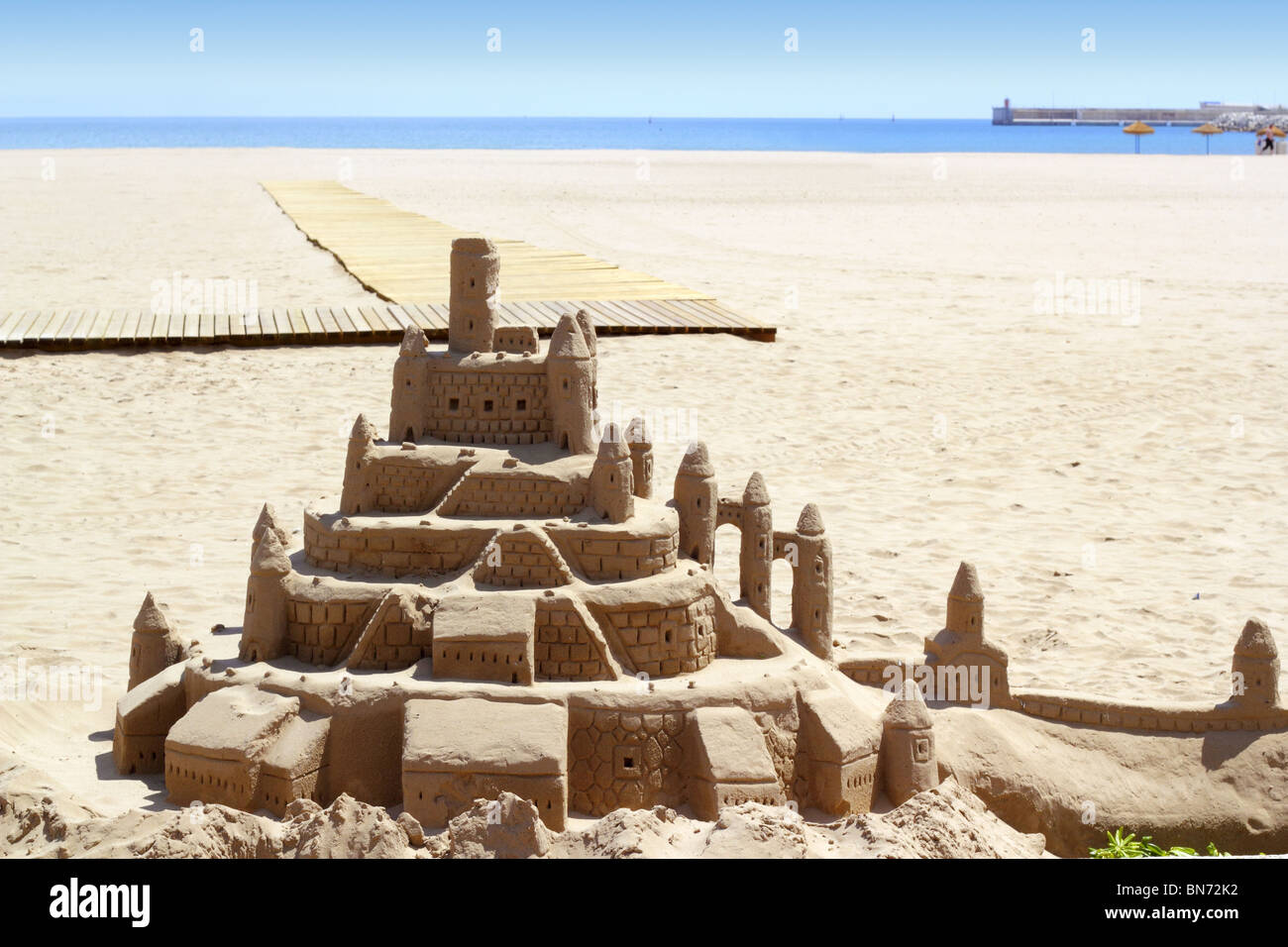 Beach sand castle summer vacation street art blue sea background Stock ...