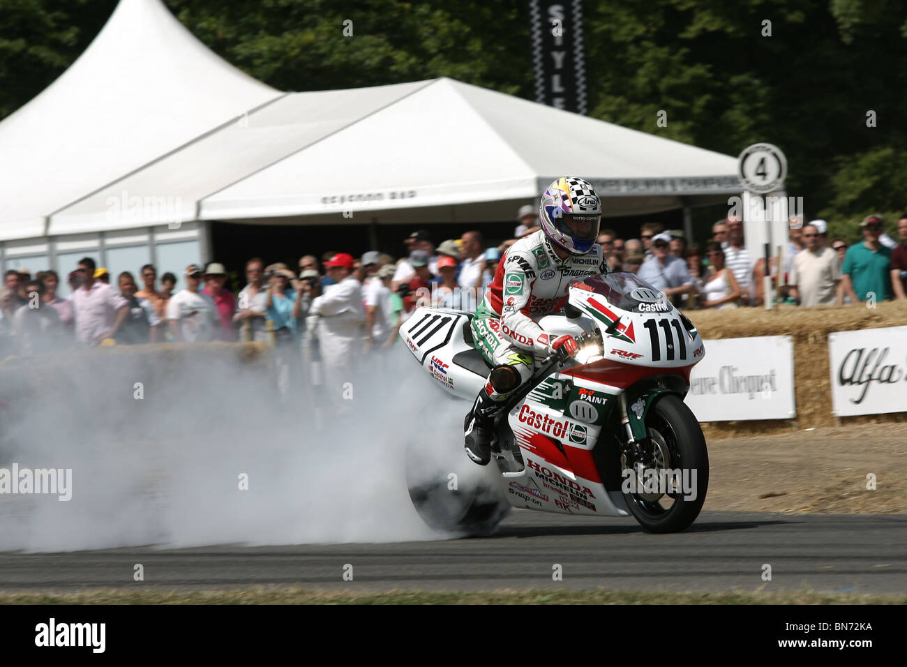 Honda World Superbike rider Aaron Slight lights up his tyres at the 2010 Goodwood Festival of Speed, Goodwood House. Stock Photo