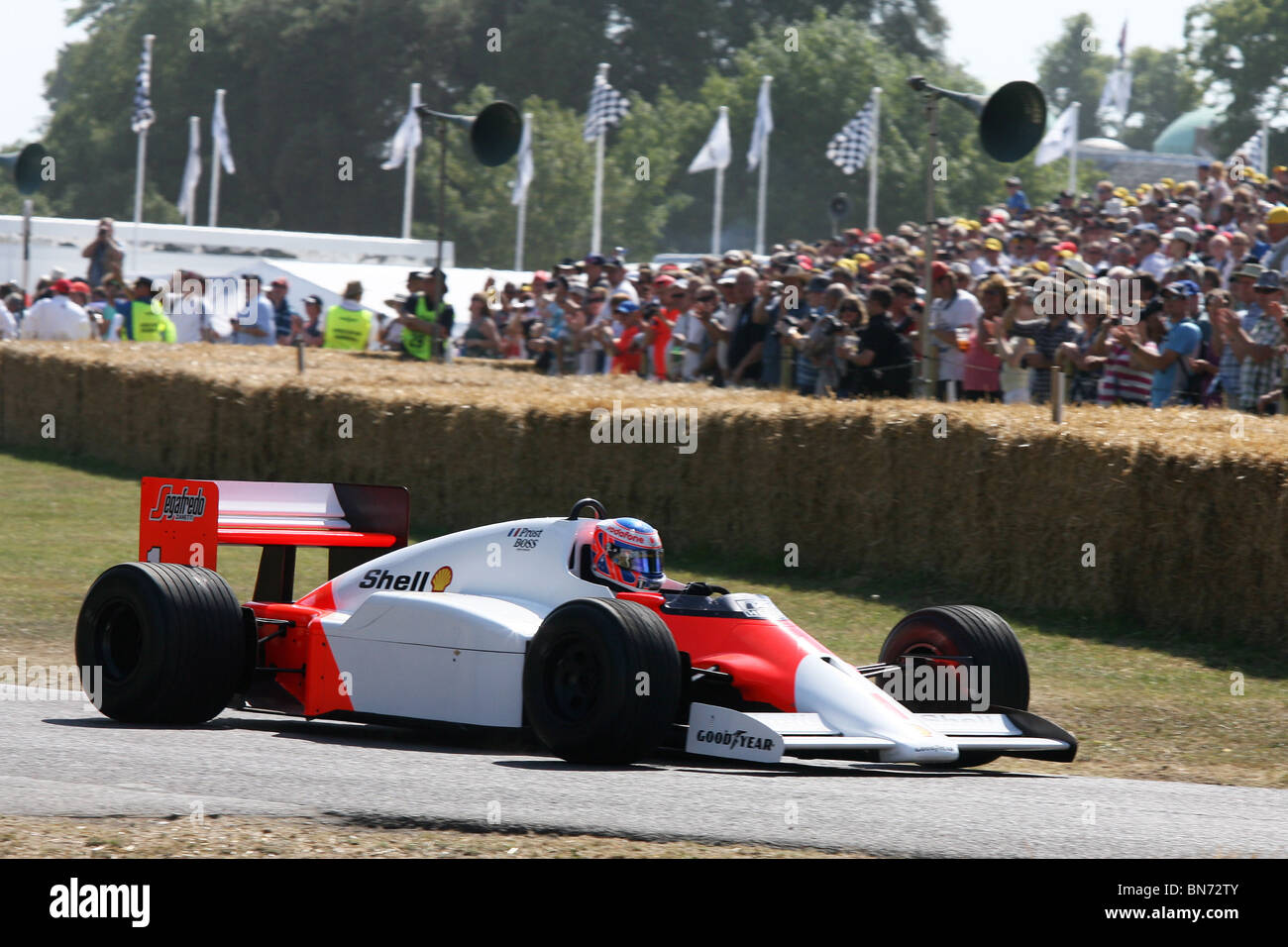 Jenson Button Powers A Mclaren F1 Car Up The Hill At The 10 Stock Photo Alamy