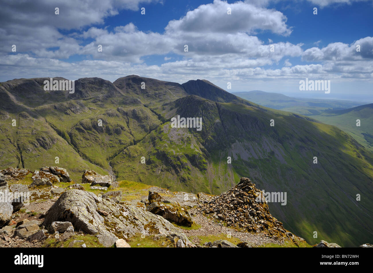 A view across to the Scafell massif from Westmorland Cairn on Great Gable in the Lake District Stock Photo