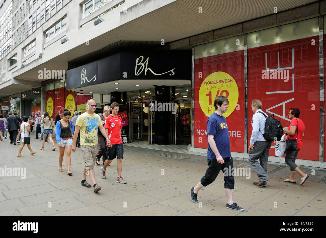 People passing BHS Oxford Street London England UK Stock Photo