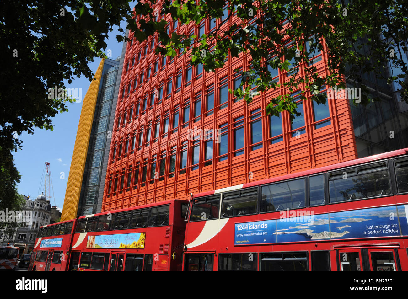 Bright, colourful buildings and buses in the west end of London, England, UK Stock Photo Alamy