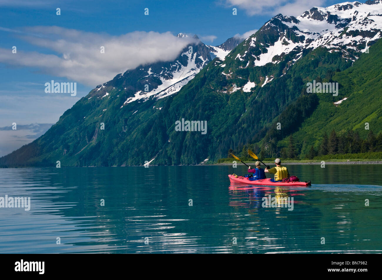 Couple kayaking in Shoup Bay, Prince WIlliam Sound, Alaska Stock Photo