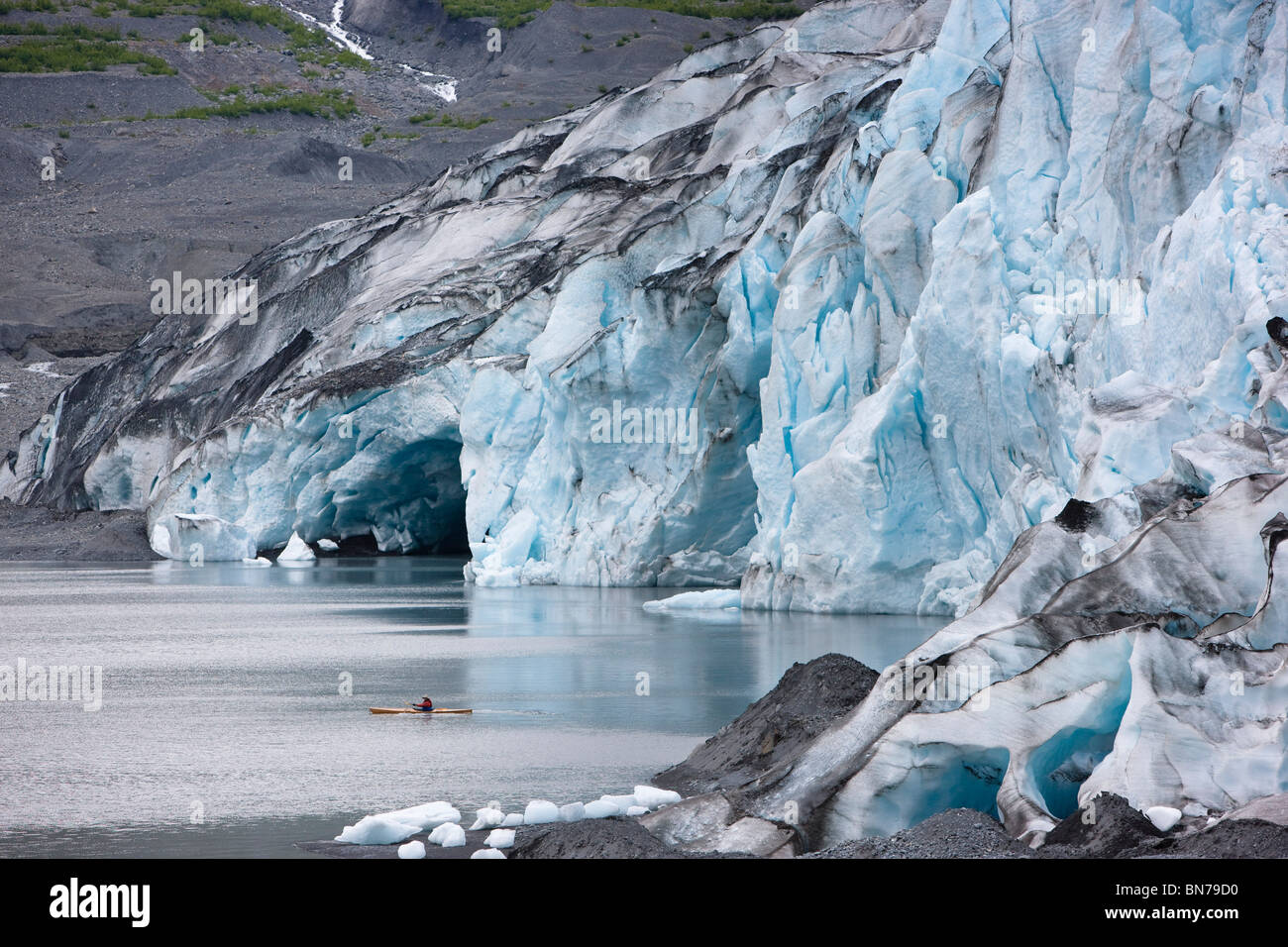 Man kayaking in Shoup Bay with Shoup Glacier in the background, Shoup Bay State Marine Park, Prince William Sound, Alaska Stock Photo