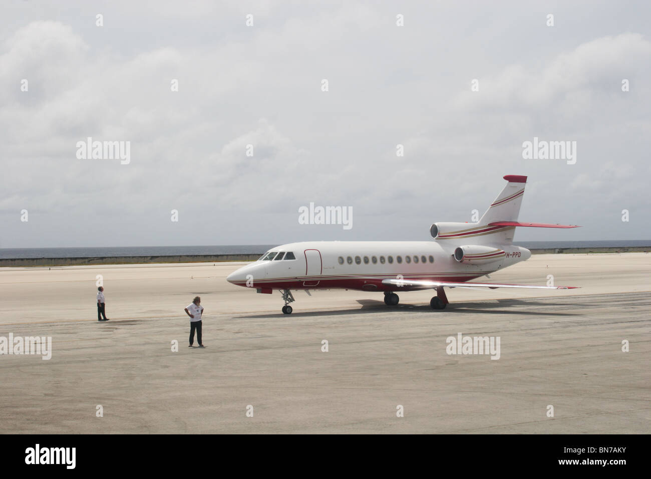Private jet plane sitting on runway tarmac at airport Stock Photo Alamy