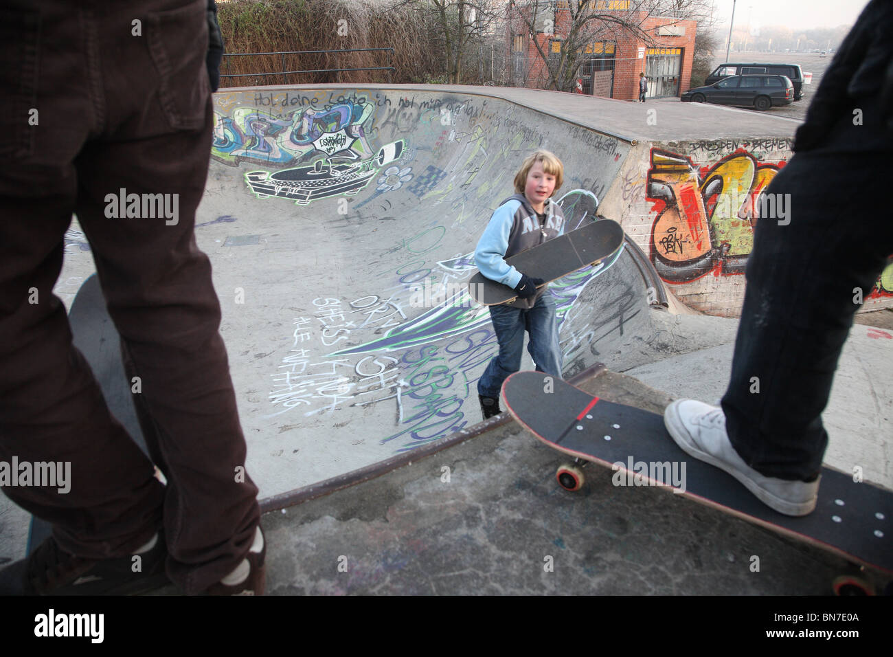 Young skateboarders in a halfpipe, Bremen, Germany Stock Photo