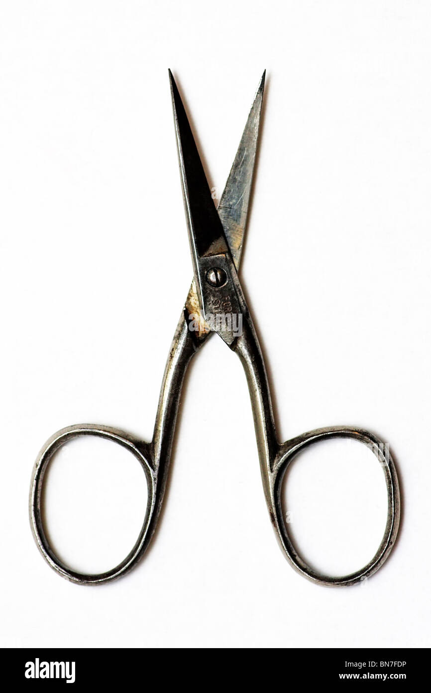 Small steel scissors on a white background Stock Photo