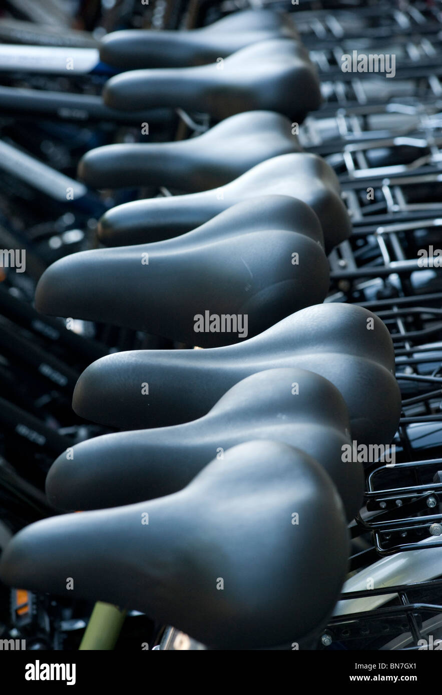 Many bicycles for hire outside shop in Berlin Germany Stock Photo