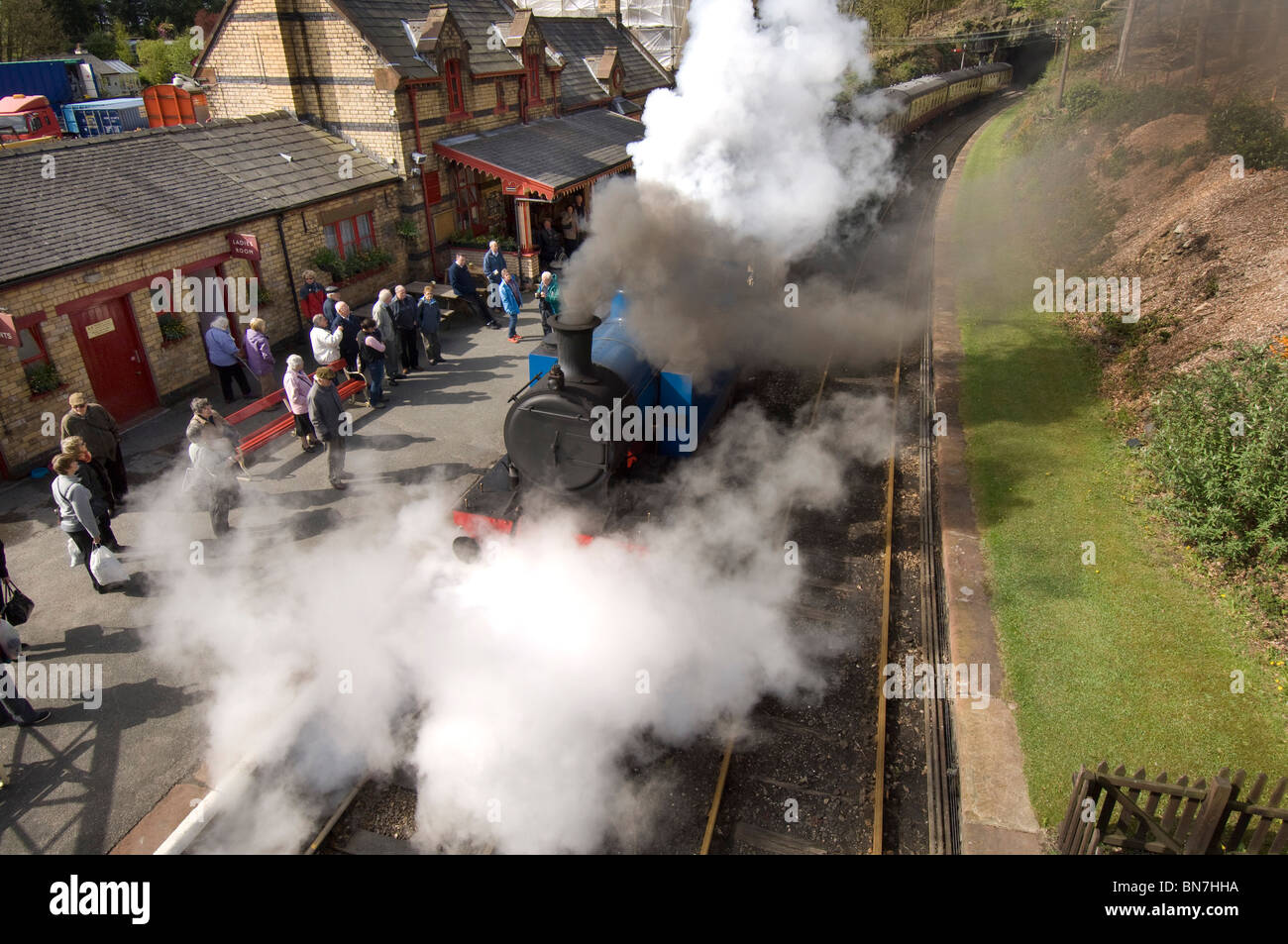 A vintage steam locomotive train at Haverthwaite station in the Lake District, Cumbria England UK Stock Photo